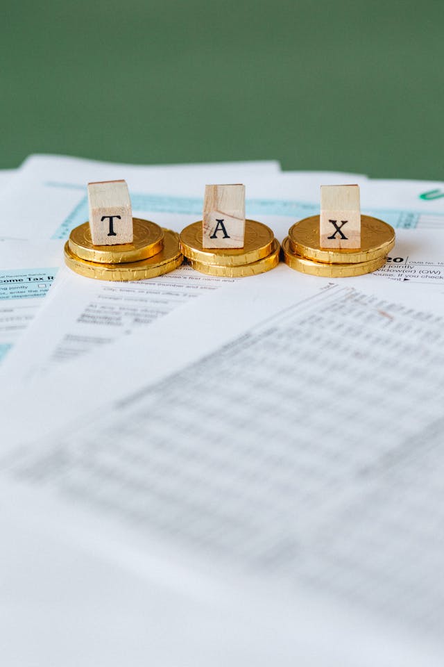 Gold coins and IRS tax forms symbolizing retirement tax planning and TSP Roth catch-up rules for Federal Law Enforcement Officers.